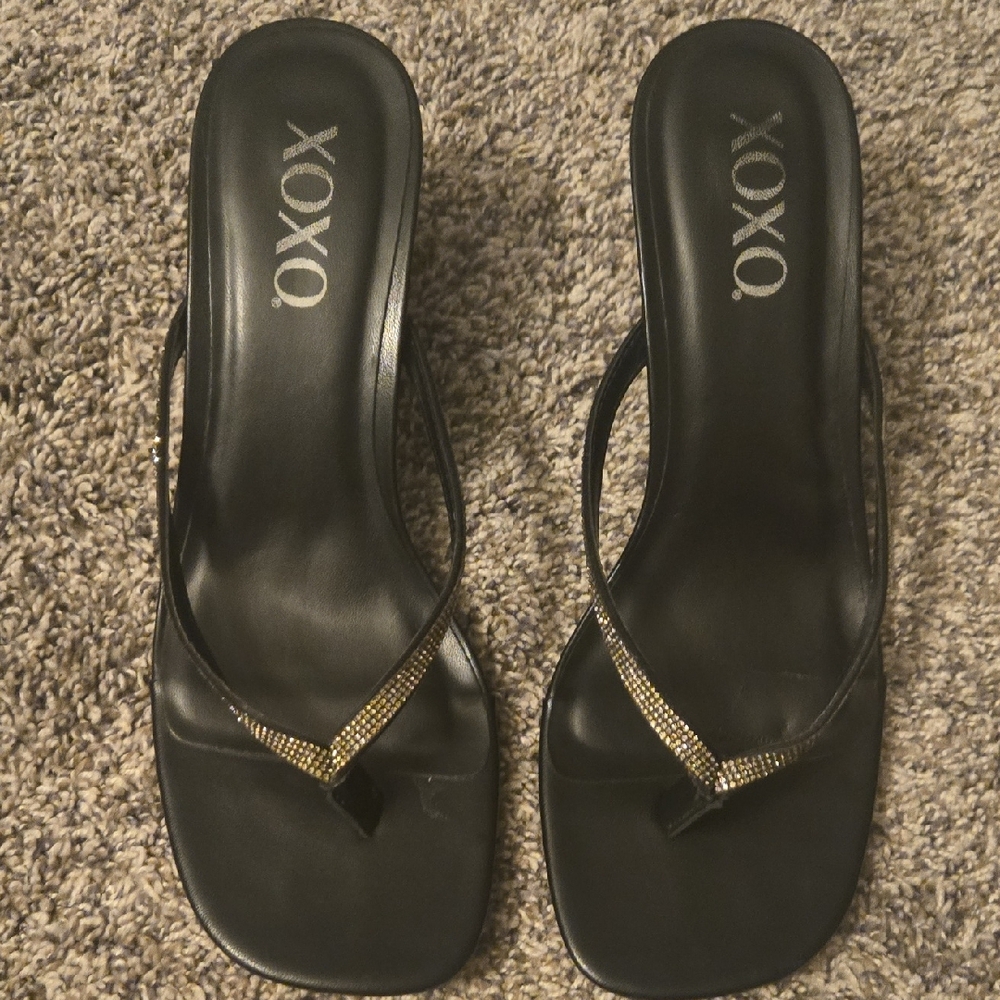 XOXO Black and Gold Thong Sandals with Metallic Accents